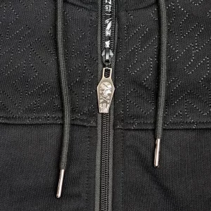Glissière personnalisée et motifs cousus en ton-sur-ton.
